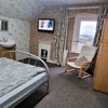 Photo 2: Room 4 is a comfortable double bedroom with a wash basin in the room. 