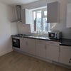 Photo 1: Shared Dining/ Kitchen area