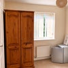 Photo 3: Cupboard space with mini fridge 