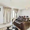 Photo 7: Bright and comfortable shared living area with plenty of space to relax.