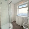 Photo 6: Shower and toilet