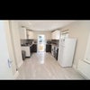 Photo 2: Kitchen/ dining space (now has table and chairs)
