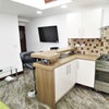 Photo 2: Shared kitchen/living space