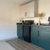 Photo 2: Private kitchenette with fridge, microwave & sink