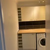 Photo 8: Utility Room (washer + dryer + cabinets)