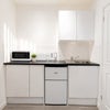 Photo 5: Fridge freezer, toaster, kettle, microwave and induction plug in hob provided.