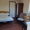 Photo 5: Downstairs room showing bed
