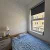 Photo 2: Double bed by large breezy, sunny windows