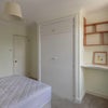 Photo 2: Available bedroom showing built-in wardrobe