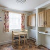 Photo 9: Utility room with extra kitchen cabinets