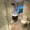 Photo 2: Modern Primary Shared Bathroom