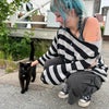 Photo 4: petting a cat in sweden