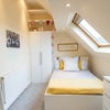 Photo 2: Brightly-lit Room 6