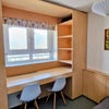 Photo 7: Bedroom 3 built in shelving and desk, custom made in birch plywood.