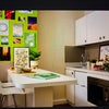 Photo 2: Cooking area with breakfast bar