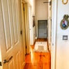 Photo 7: Hallway from living area (bathroom 1st left, bedroom 2nd  left)