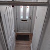 Photo 5: Entrance with parking