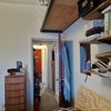 Photo 8: view through hallway to lounge
