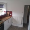 Photo 6: Dedicated cupboards and fridge space