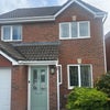 Photo 9: Front of House with driveway parking