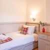 Photo 9: single bed in living room