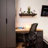 Photo 5: Cubbord and desk in room