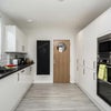Photo 10: Communal Kitchen and Living Area