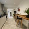 Photo 10: Communal Kitchen and Living Area