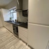 Photo 12: Communal Kitchen and Living Area