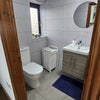 Photo 5: Toilet with bath tub