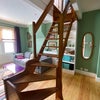 Photo 7: A view of the wooden staircase. 