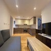 Photo 3: Sitting room and Kitchen 