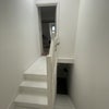 Photo 7: Stairwell to get to upper floor from lower floor