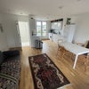 Photo 2: Looking across living room and refurbished kitchen
