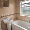 Photo 8: Modern, spacious bathroom with bath and powerful electric shower.