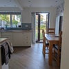 Photo 6: Shared living room kitchen area. 