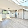 Photo 2: Spacious open-plan studio filled with natural light.