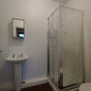 Photo 3: The en-suite consists of a cubicle shower, mirrored cupboard, sink and toilet.