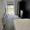 Photo 2: Front bedroom from door view