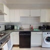 Photo 4: Kitchen (includes washing machine and dishwasher)