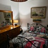 Photo 7: Bedroom showing bed, fan and decor