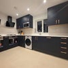 Photo 4: Kitchen / Communal kitchen - 2 x oven 2 x hobs 2 x washer/dryer 2 x Fridge/freezers