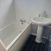 Photo 6: Shared bathroom with shower over bath
