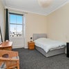 Photo 2: Bedroom 1 - with a view of Arthur's Seat and morning light