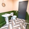 Photo 4: Communal toilet and bathroom