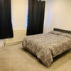 Photo 2: Double bed and blackout curtains. Wardrobe in each room
