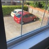 Photo 4: View from bedroom (parking space available)