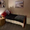 Photo 6: Bed & bedside cabinet. Linen basket