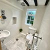 Photo 5: downs stairs shower Room