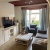 Photo 6: Living room with smart TV and built-in storage